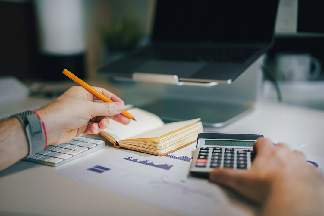 person calculating medical expenses