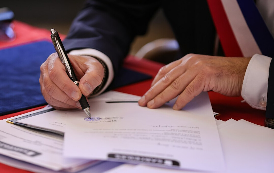 person signing insurance papers
